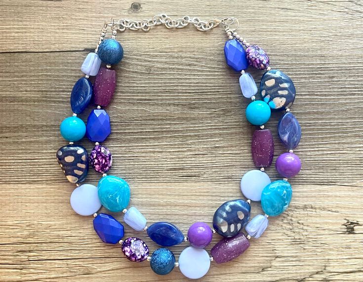 💞One of a kind & ready to ship💞 Dress up any outfit - great for a night out or with a white tee! 17 Inch Necklace with a 4 inch silver extender chain and silver lobster clasp. This is an eclectic bunch of acrylic beads in shades of blue and purple 😍 A total conversion starter! Thank you for supporting American small business! *Smoke and pet free home!* I ship 6 days a week! This particular necklace one of a kind and is READY TO SHIP! Thank you for browsing my store! Chunky Necklaces Statement Crystal, Blue Adjustable Bib Necklace With Round Beads, Adjustable Blue Bib Necklace With Colorful Beads, Adjustable Blue Bib Necklace With Round Beads, Adjustable Blue Bib Necklace For Party, Blue Beaded Bib Necklace For Party, Blue Costume Jewelry Necklace With Large Beads, Party Necklaces With Colorful Blue Beads, Blue Necklaces With Colorful Beads For Party