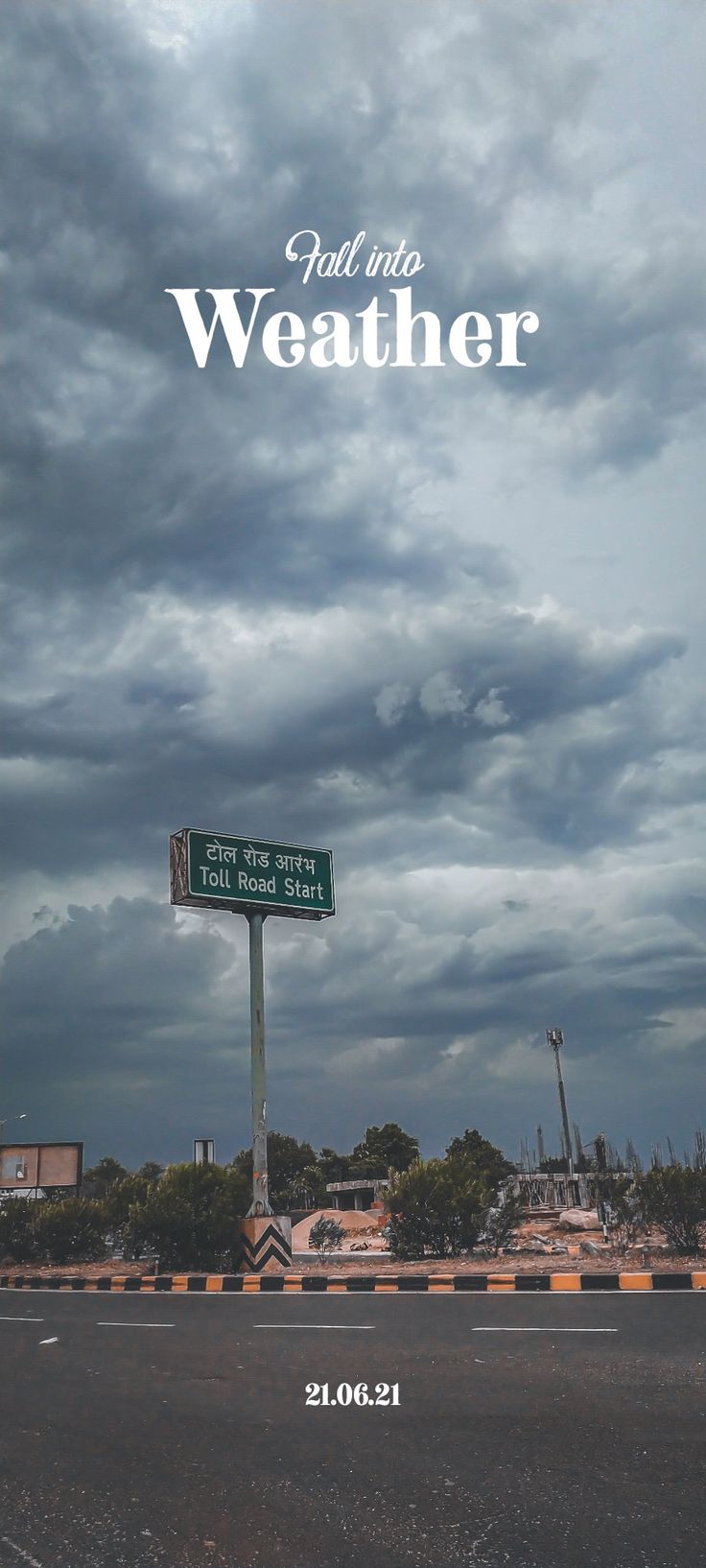 an image of a street sign that is on the side of the road with clouds in the background