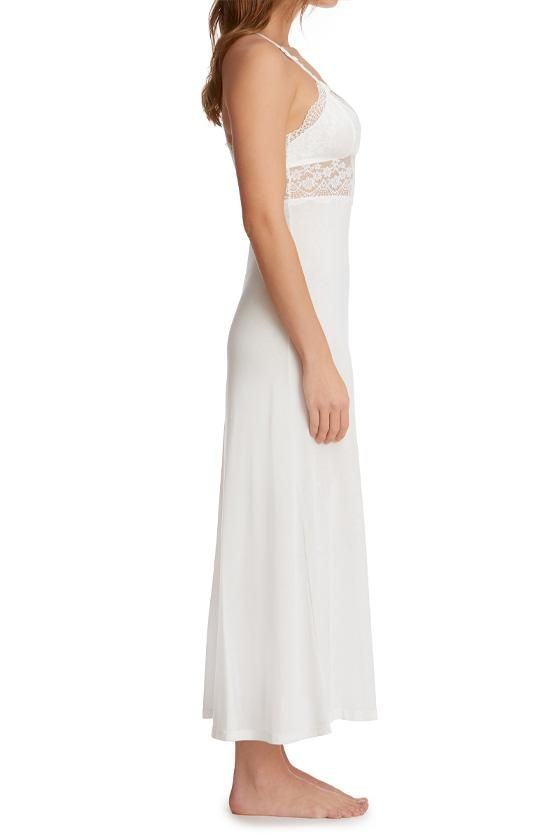 - Bouquet Collection- Dreamy long gown in stylish fan-patterned stretch lace and soft jersey- Sesmed lace cups with jersey lining- Unlined lace midriff- Flared A-line jersey skirt with coverstitch hem- Venise lace appliqué at front straps- Adjustable x-back straps with rose gold-colored hardware- Ankle length (approximately 54 inches from shoulder to hem)- Silk WhiteFabricationLace: 84% Nylon 16% Spandex; Mesh: 89% Nylon 11% Spandex; Tulle: 100% Nylon; Lining 100% Supima® Cotton; exclusive of tr Evening Lace Stretch Maxi Dress, Elegant Fitted Maxi Dress With Contrast Lace, Elegant Stretch Maxi Dress With Lace Trim, Stretch Lace Maxi Dress For Evening, Fitted Lace Maxi Dress With Lace Bodice, Fitted Lace Bodice Maxi Length Dress, Fitted Maxi Dress With Contrast Lace For Evening, Fitted Lace Dress With Maxi Length Bodice, Fitted Contrast Lace Dress For Wedding Night