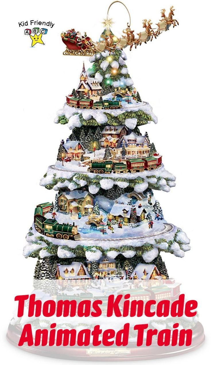 a christmas tree with santa's sleigh and train on the top is shown