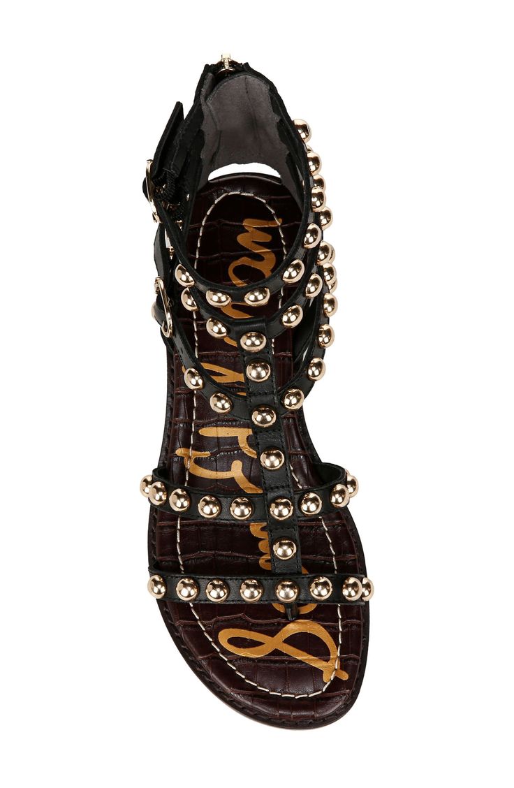 Gleaming studs and buckled ankle straps embolden a cage-inspired sandal fitted with a rear zipper for easy entry. 3/4" heel (size 8.5) 4 1/2" shaft Back zip closure; adjustable ankle straps with buckle closures Leather upper/synthetic lining/rubber sole Imported Leather Sandals With Gold Studs For Spring, Spring Sandals With Gold Studs And Round Toe, Black Open Toe Sandals With Gold Studs, Black Leather Sandals With Gold Studs, Nordstrom Store, Ankle Straps, Sandal Women, Sam Edelman, Nordstrom Rack