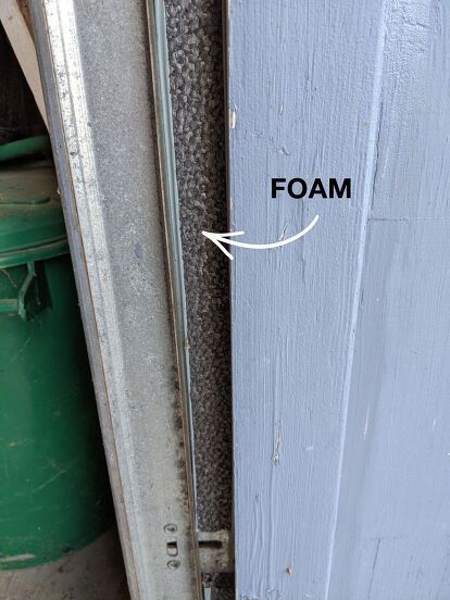 the bottom half of a door with foam on it and an arrow pointing up at the bottom