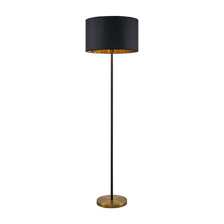 a black and gold floor lamp on a white background with a light shade over it