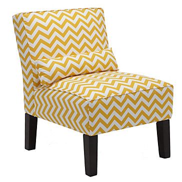 a yellow and white chevroned chair sitting on top of a black wooden legs