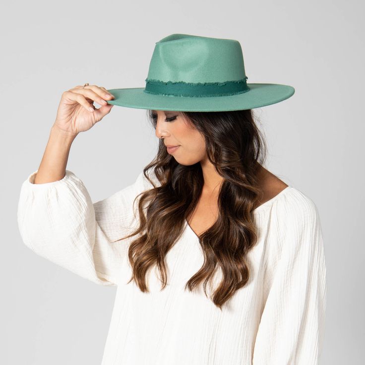 Faux felt fedora with tonal frayed cotton band. Features: Color: Teal, Pink, WhiteMaterial: 100% PolyesterBrim Size: 3.75"Women's One Size: 57cmUPF 50 Wide Brim Hat Summer, Sand Collection, Facebook Style, Fall Hats, Felt Fedora, Scarf Poncho, Teal And Pink, Dress Hats, Wide Brimmed Hats