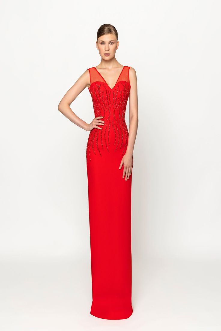 Elevate your elegance with the Naja Saade RTW23-35 v-neck crepe long dress. Adorned with intricate embroidery and a stylish overlapped cape, this dress exudes sophistication and grace. Perfect for special occasions where you want to make a statement. Formal V-neck Gown With Sheer Bodice, Luxury V-neck Maxi Dress For Gala, Luxury V-neck Evening Dress With Sweep Train, Elegant V-neck Evening Dress With Sheer Bodice, Elegant Dress With Sheer Bodice And V-neck, V-neck Cocktail Dress With Sheer Bodice, V-neck Evening Dress With Sheer Bodice For Gala, Sheer Bodice V-neck Evening Dress For Gala, Cocktail Evening Dress With Sheer Bodice And V-neck