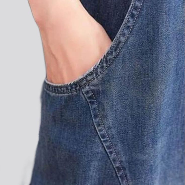 Add a dose of 90s nostalgia to your wardrobe with this Baggy Denim Jumpsuit from our 2023 Spring Collection! With its medium wash. sanded finish and rubber leg hem. this denim jumpsuit is just what you need to make a statement.Distinctive Features: 90s Vibes: From the slouchy fit to the suspenders. this jumpsuit is a nod to the days of yore. Medium Wash: A classic medium wash hue brings a timeless. effortless trend. Sanded Finish: Its sanded finish makes it stand out from the rest. Rubber Leg He Casual Dark Wash Denim Overalls, Washed Blue Denim Jumpsuits And Rompers With Pockets, Denim Overalls Jumpsuit In Medium Wash, Casual Blue Washed Shortalls, Denim Blue Overalls With Frayed Hem, Denim Overalls With Frayed Hem In Dark Wash, Medium Wash Denim Jumpsuit With Frayed Hem, Casual Medium Wash Denim Overall Jumpsuit, Casual Medium Wash Washed Jumpsuits And Rompers