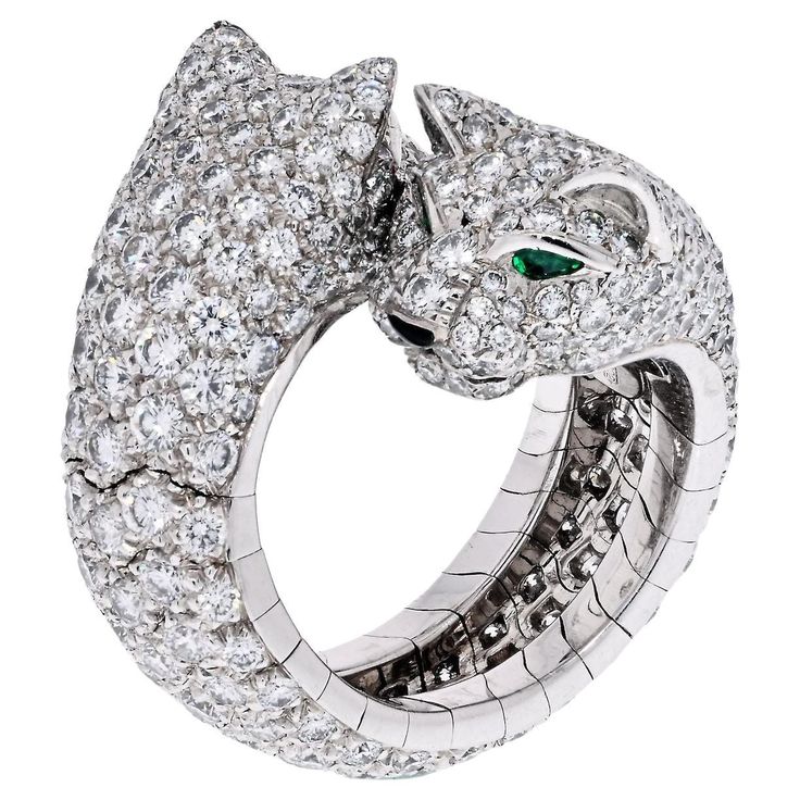 Cartier Panthere Ring, with double Lakarda diamond panthers facing each other. The Panthere de Cartier ring, made in 18K white gold, set with 356 brilliant-cut diamonds, totaling 5.04cts. Eyes and nose: emeralds, onyx. Serial 9387**. With a Cartier certificate. Size 5.75 Cartier Jaguar, Cartier Panther Ring, Panther Ring, Fancy Jewellery Designs, Cartier Panthere, Head Ring, Double Diamond, White Gold Set, Pave Diamond Ring