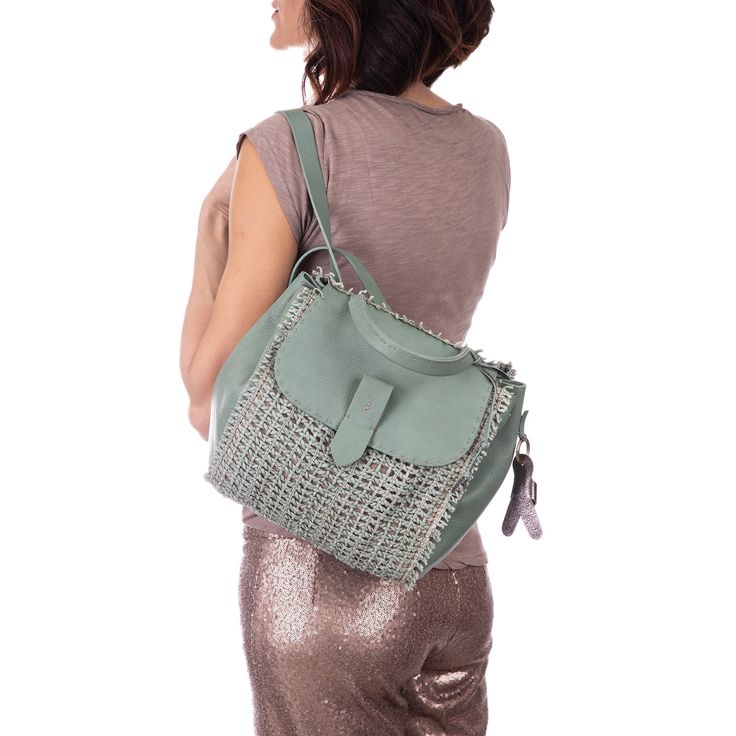 Calf woven leather backpack in sage green color Hand-sewn stitching Top handle; 28 cm (11.02'') Flap top with tuck lock closure Removable hanging with logo in leather Adjustable shoulder straps Inside: leather lining, one open pocket made in leather Dimensions: H29xL38xD13 cm (H11.41"xL14.96"xD5.1") Handmade product, made in Vigevano (Italy) Henry Beguelin bag BD4324 Green Bags With Braided Handles For On-the-go, Everyday Green Woven Leather Shoulder Bag, Green Rectangular Leather Backpack With Detachable Strap, Green Woven Leather Shoulder Bag With Double Handle, Green Woven Leather Shoulder Bag For Errands, Green Woven Leather Shoulder Bag For Everyday Use, Green Woven Leather Bag With Double Handle, Green Leather Backpack With Detachable Strap For Everyday, Leather Satchel Backpack With Handles