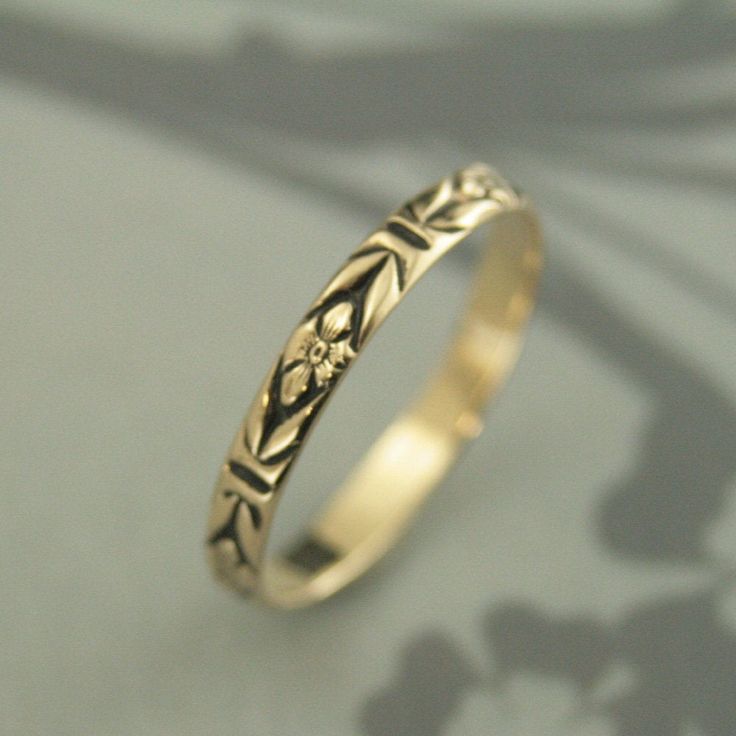 "Gold Antiqued Ring~Gold Wedding Band~Orange Blossom Ring~Romance Band~Antiqued Gold Band~Black Gold Ring~Women Gold Ring~Vintage Style Ring Introducing our new ANTIQUED Gold Bands! This solid 14K gold ring is hand crafted from preformed pattern wire. It features a lovely floral design and can be custom made in any ring size. The detail is so exquisite it looks as if it was hand engraved! Measuring 2.8mm (just under 1/8\") wide and a slim .75mm thick, it is perfect as a petite wedding ring or st Adjustable Antique Finish Wedding Jewelry, Antique Finish Adjustable Wedding Jewelry, Gold Wedding Ring With Antique Finish, Gold Rings With Antique Finish For Wedding, Antique Finish Round Wedding Jewelry, Heirloom Wedding Flower Ring With Engraving, Heirloom Wedding Flower Ring Engraved, Antique Finish Anniversary Jewelry Ring, Vintage Yellow Gold Stackable Wedding Rings