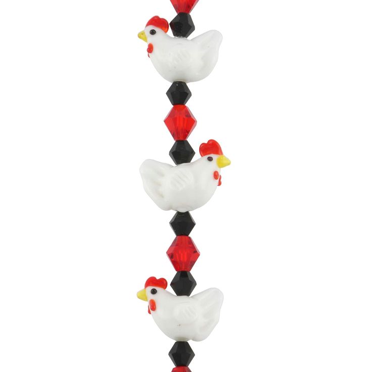 three white and black roosters are standing on top of each other in the same pattern