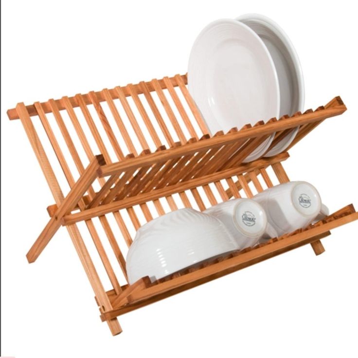 a wooden dish rack with dishes on it