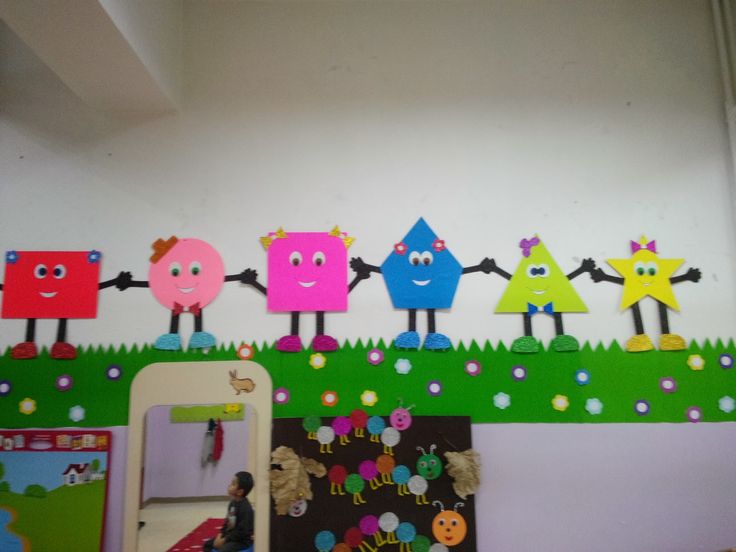 the wall is decorated with colorful cartoon characters