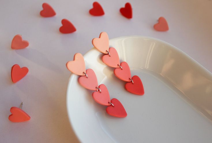 several hearts are placed on a white plate