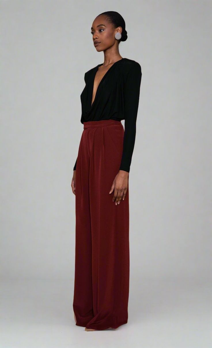 The Santana Pant is a must-have for your fall wardrobe. The soft satin in the rich rust color adds a touch of elegance to everyday looks. Easily dressed up or down, make it your new go-to statement pants. Elegant Silk Bottoms For Date Night, Burgundy Wide Leg Pants For Party, Chic Burgundy Pants For Party, Burgundy Bottoms For Formal Fall Occasions, Formal Burgundy Bottoms For Fall, Chic Burgundy Party Pants, Red Silk Party Bottoms, Chic Red Silk Bottoms, Elegant Burgundy High-waisted Wide Leg Pants