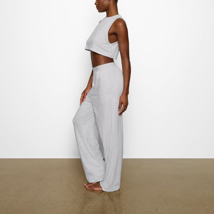 A straight-leg relaxed-fit pant in the ultra-soft Boyfriend fabric you can’t get enough of. This full-length style features an elastic waistband with logo details and 2 side pockets. Fits true to size. | SKIMS Loose Pants | Grey | Boyfriend Soft Boyfriend, Lounge Style, Relax Pants, 2024 Christmas, Boyfriend T Shirt, Loose Pants, Womens Sweatpants, Christmas List, Workout Pants