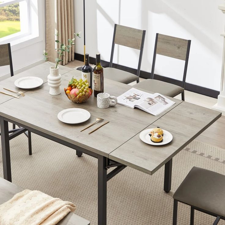 a dining room table with plates and food on it