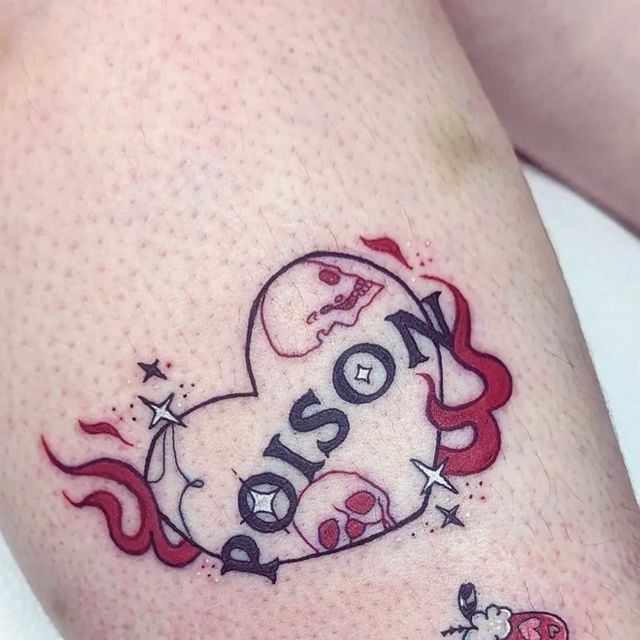 a small tattoo on the leg of a woman's thigh that reads, boston