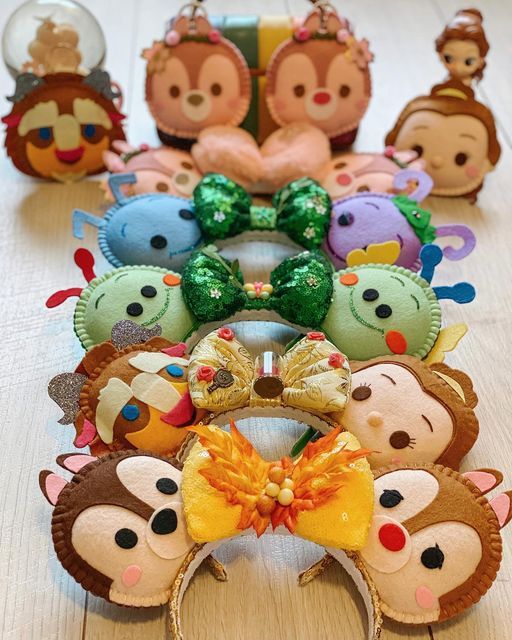 a group of animal headbands sitting on top of a wooden table