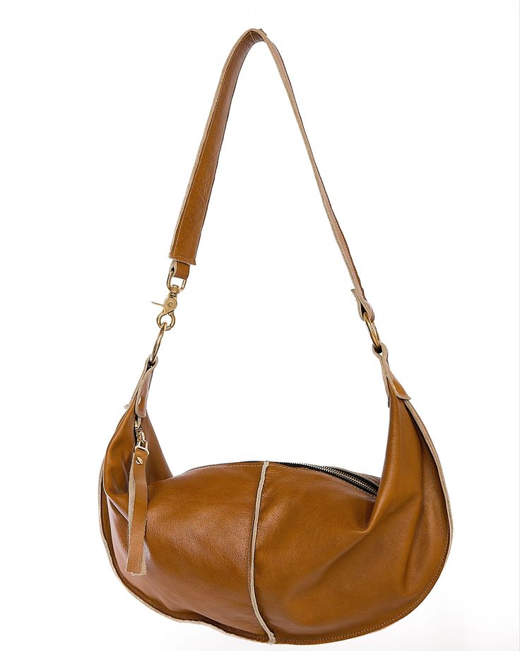 Everyday Satchel Baguette Bag With Handle Drop, Baguette Satchel Bag With Handle Drop For Everyday Use, Luxury Hobo Bag For Travel, Luxury Hobo Travel Bag, Versatile Cognac Hobo Bag, Versatile Cognac Hobo Bag For Everyday Use, Cognac Hobo Bag With Detachable Strap For Everyday Use, Brown Crossbody Baguette Bag For Everyday, Brown Baguette Bag For Everyday Use