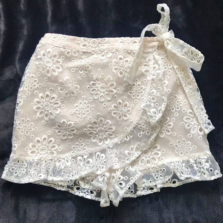 Revolve Lovers & Friends Faux Wrap Organza Shorts Cream Elastic Pull On Faux Wrap Shorts Embroidered Organza Ruffle Hem Waist 13” Stretches To 16” New Without Tags Feminine Short Bottoms For Night Out, Feminine Short Bottoms For Party, Chic Lace Bottoms For Vacation, Spring Lace Bottoms For Day Out, White Lace Bottoms For Brunch, White Lace Brunch Bottoms, White Lace Bottoms For Day Out, Fitted Lace Bottoms For Day Out, Friends Shorts