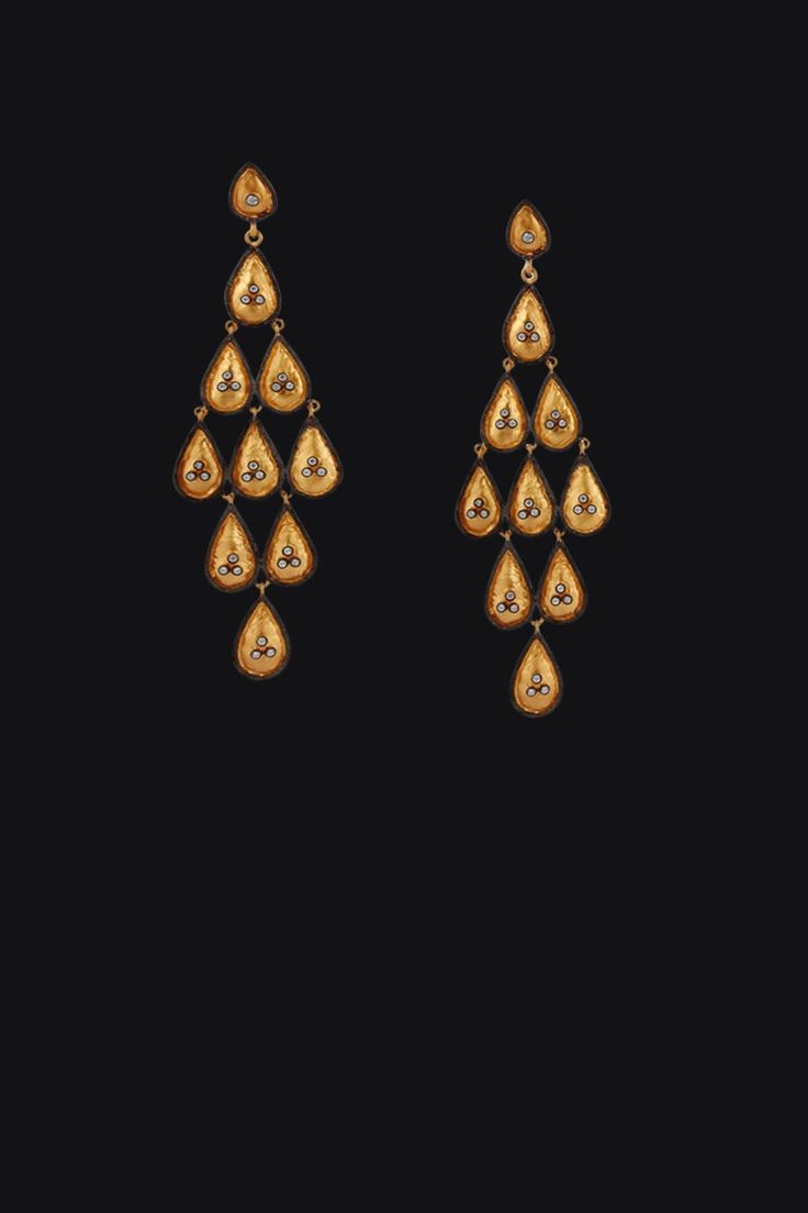 Radiate elegance with the enchanting sparkle of Diamond Drops Chandelier Earrings in textured gold. Featuring vibrant polki diamonds set in luxurious gold, each earring cascades in a graceful chandelier design, capturing light with every movement. An ultimate blend of sophistication and striking beauty, these dangle earrings are perfect for adding a touch of glamour to your outfits. Metal: 24K Gold Vermeil Polki Diamonds: 0.28 ctw Length: 3 inches One of a Kind handmade item Note: These gorgeous earrings were chosen by Ann Hathaway for the Oscars 2016 Ceremony and Vanity Fair after-party Elegant Rose Cut Diamond Chandelier Dangle Earrings, Luxury Drop Chandelier Earrings With Intricate Design, Luxury Intricate Design Drop Chandelier Earrings, Luxury Intricate Design Chandelier Drop Earrings, Luxury Rose Cut Diamond Chandelier Earrings For Wedding, Elegant Gold Chandelier Earrings For Reception, Elegant 22k Gold Earrings For Reception, Luxury Chandelier Earrings For Festive Occasions, Luxury Festive Chandelier Earrings