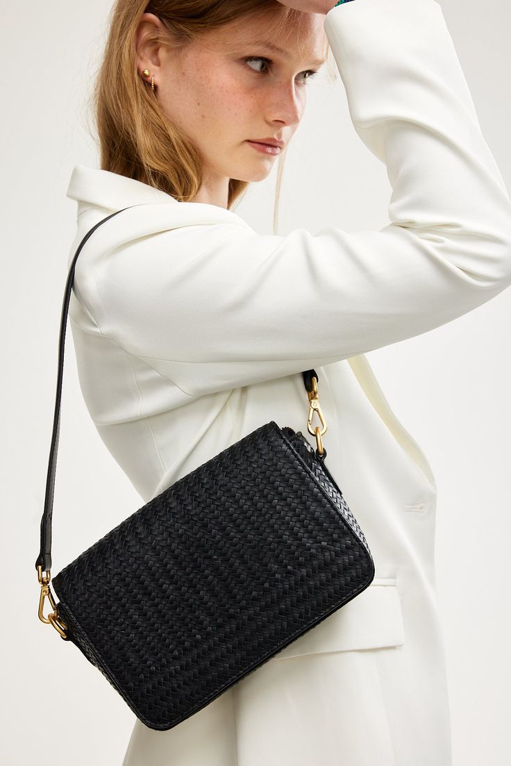 The Elsa Woven Crossbody Bag - a timeless piece made for your everyday. Inspired by the classic French-girl style this modern take on the baguette shape is designed to withstand seasonal trends and effortlessly elevate any outfit. Wear it three ways: as a crossbody, as a shoulder bag, or remove the strap and carry it as a sophisticated clutch. Handy external back pocket for your phone. (Includes leather shoulder strap and leather crossbody strap). Crafted from luxurious, buttery soft premium lea Everyday Luxury Clutch Baguette Bag, Classic Satchel Baguette Bag With Single Shoulder Strap, Classic Rectangular Baguette Bag For On-the-go, Luxury Everyday Baguette Bag, Versatile Everyday Clutch Flap Bag, Classic Crossbody Baguette Bag For Daily Use, Classic Crossbody Baguette Bag With Removable Pouch, Luxury Crossbody Baguette Bag For On-the-go, Timeless Everyday Rectangular Saddle Bag