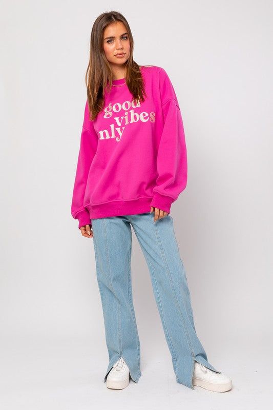 Hot pink long sleeve pullover sweatshirt with "Good Vibes Only" embroidery. relaxed oversized fit. Pink Sweater For Streetwear In Fall, Pink Sweater For Fall Streetwear, Trendy Crew Sweats For Spring, Casual Pink Sweater With Ribbed Cuffs, Oversized Pink Sweater For Streetwear, Relaxed Fit Pink Hoodie With Ribbed Cuffs, Casual Pink Sweater With Graphic Print, Pink Crew Neck Sweats For Spring, Pink Long Sleeve Sweatshirt With Ribbed Cuffs