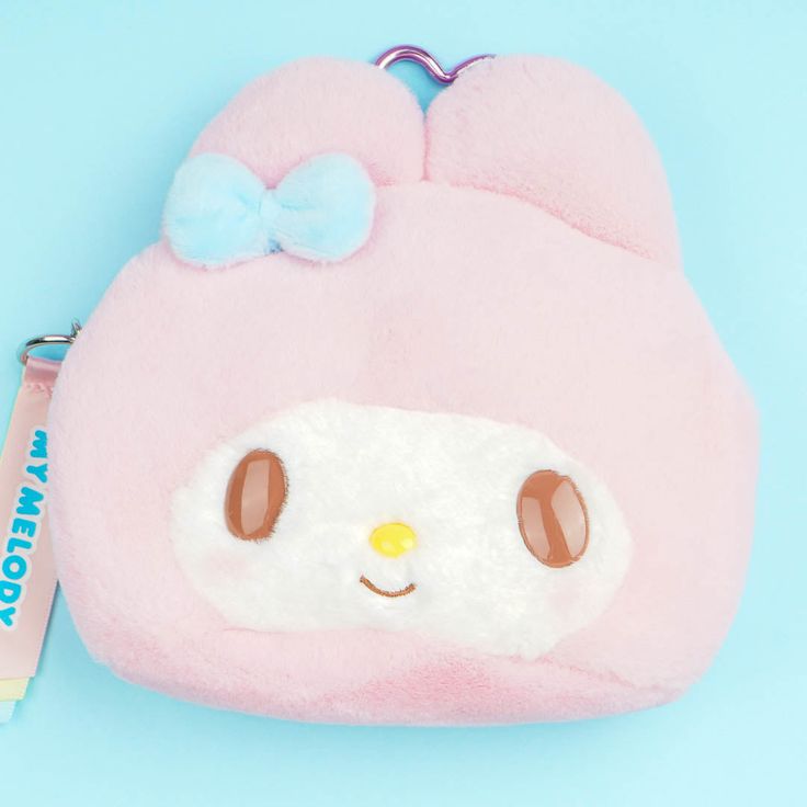 Keep your powder compact, folding comb, and other small beauty essentials inside this kawaii My Melody face pouch! This soft and fluffy case also comes with a unique transparent window at the back — so you don’t need to open it often to check on your stuff. Made from super soft material Comes with a zipper closure and a heart-shaped metal carabiner Created in celebration of the 2024 Sanrio Character Awards Kawaii Pink Coin Purse For Daily Use, Cute Pink Pouch Coin Purse, Pink Kawaii Cosmetic Bag Gift, Pink Rectangular Kawaii Coin Purse, Cute Pink Compact Bag, Cute Compact Pink Bag, Cute Pink Coin Purse, Cute Pink Coin Purse For Personal Use, Pink Compact Pouch