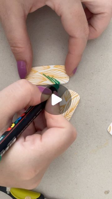 two people are doing crafts together with crayons