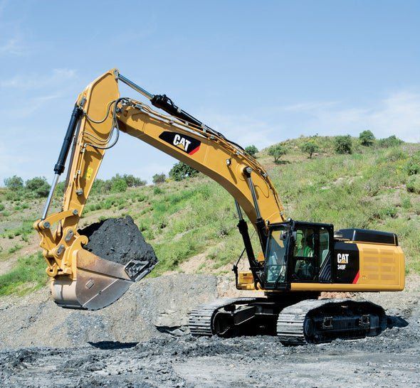 an excavator is digging through the ground