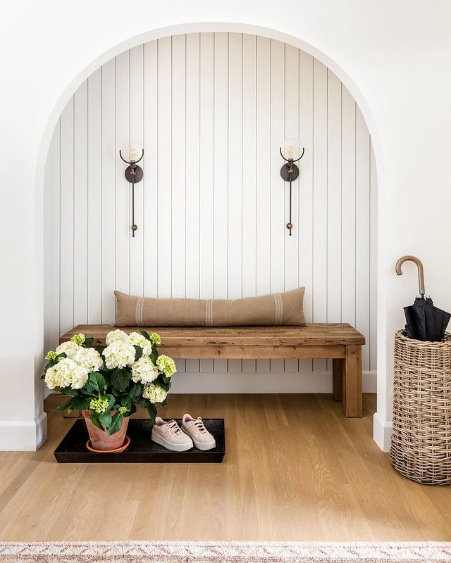 a room with white walls and wood flooring is featured in the instagram page