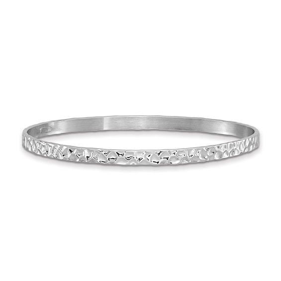 With a beautiful light-catching finish, this slip-on bangle bracelet adds sizzle to your stack. Sterling silver Deeply textured and polished hammered finish 4.5mm width 7.0mm inches in circumference Beautiful Lights, Bangle Bracelet, Bangle Bracelets, Bangles, Slip On, Bracelet, Sterling Silver, Silver