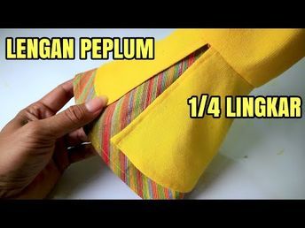 a person is tying a tie on top of a yellow object with the words lengan pepum below it