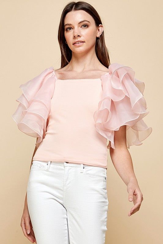 Refresh your wardrobe with this exquisite women's casual blouse. Cut from luxuriously soft fabric and finished with layered ruffles and short sleeves for a chic effect. A perfect statement piece for any special occasion or a casual day out. Peach color Layered Ruffles Short Sleeves