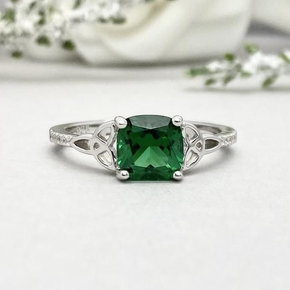 This beautiful ring is made from genuine 925 sterling silver with rhodium plating.Ring details--The Main stone is a Cushion Cut 7MM Lab Created Nano Emerald Stone -Side stones are 1mm Round simulated diamonds -Ring is casted in solid 925 sterling silver with rhodium plating (yellow gold and rose gold plated also available, please check the drop down menu for more options)-The Total face height of the ring measures 7.5mms and the band width measures 2mms-Each ring is handmade and made to order, s Silver Princess Cut Emerald Ring For Wedding, Classic Green Jewelry For Promise Occasions, Wedding Emerald Ring In 14k White Gold, Silver Birthstone Ring In 14k White Gold For Gift, Sterling Silver Emerald Promise Ring, Sterling Silver Ring With Prong Setting For May Birthstone, Silver Emerald Ring With Princess Cut And Prong Setting, Sterling Silver Emerald Promise Ring For May Birthstone, Classic Green Ring For Promise