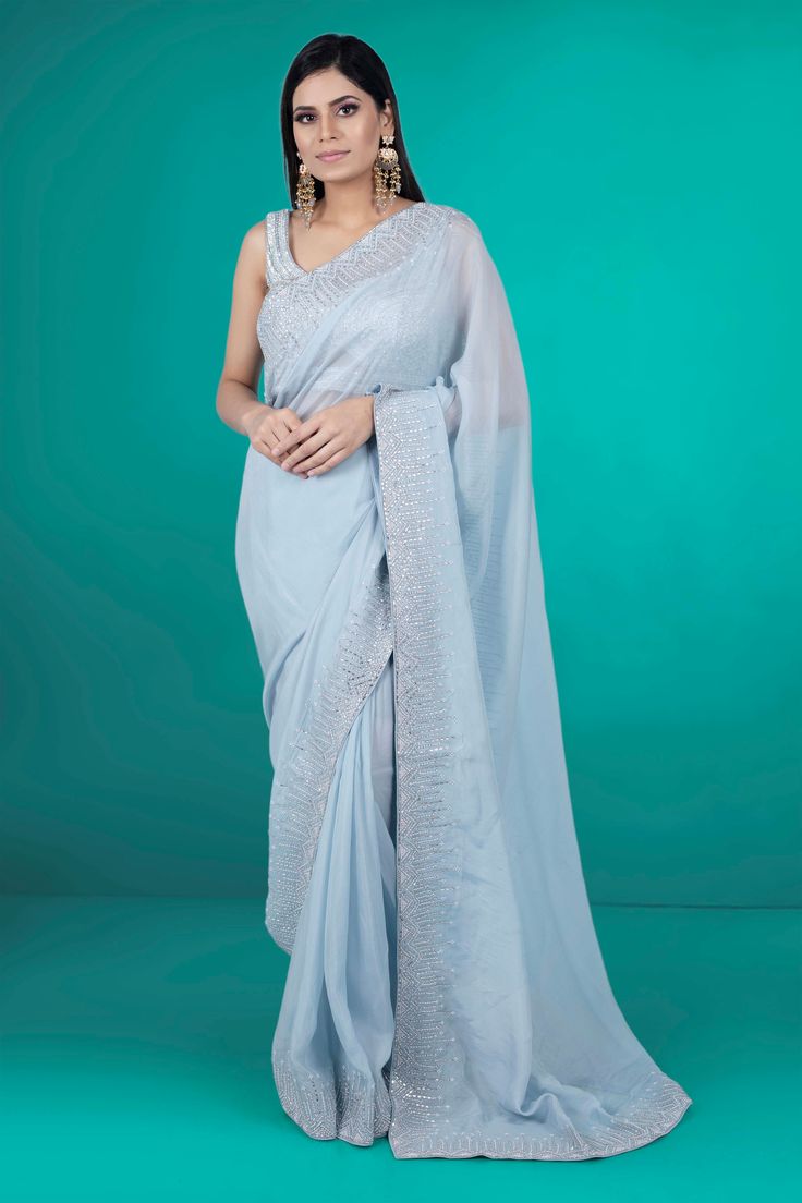 Get ready to rock any party with this stunning Party Wear Saree D-211. Featuring intricate stone work, this saree will surely make you stand out and be the center of attention. Don't settle for a basic saree, elevate your party look with this one-of-a-kind piece! Extra fabric inside the blouse Waist is stretchable Embellished Chanderi Saree For Navratri, Party Embellished Chanderi Saree, Embellished Chanderi Saree For Reception, Embellished Chanderi Saree In Traditional Drape, Formal Saree With Resham Embroidery For Navratri, Embellished Chanderi Saree For Eid, Embellished Semi-stitched Chanderi Pre-draped Saree, Embellished Tissue Silk Saree, Party Floor-length Chanderi Saree