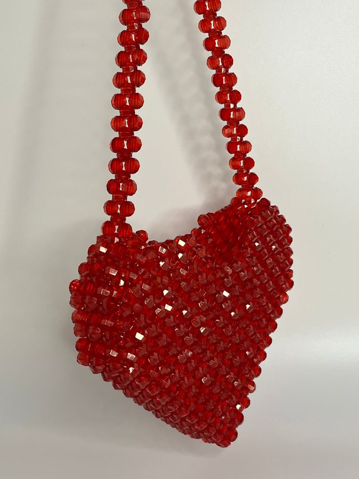 Hand made beaded bags designed in the form of heart  .  They are shoulder or top handle bags which will go well with outfits especially in summertime . Heart Shape Beaded Bag, Glamorous Heart-shaped Evening Bag, Chic Red Heart-shaped Bag, Pink Heart-shaped Evening Shoulder Bag, Heart-shaped Evening Bags With Chain Strap, Beaded Bags, Top Handle, Purses And Handbags, Heart Shapes