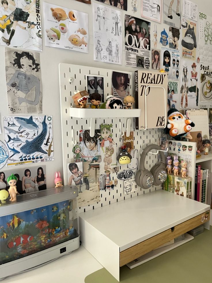 there are many pictures on the wall above the desk