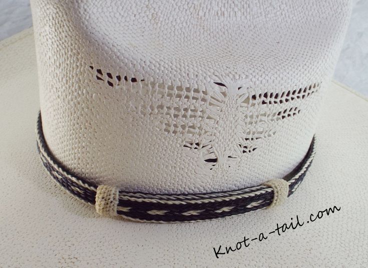 this horsehair hat band is a Bolder hat band done in black and white horsehair. 100% all natural horsehair. Everything you have been looking for in a Horsehair hat band. Distinctive look, uncompromising quality, and a unique design. * This is a 5 strand horsehair hat and that is about 5/8 inches wide.. You will find it easy to adjust to fit most any size hat with the two sliding knots. Brings out your spirit in an exclusive design that is vibrant as your western lifestyle. MEASUREMENTS * Longest White Brimmed Hat Bands For Rodeo, White Adjustable Hat With Flat Crown, White Country Hat With Flat Crown, White Flat Crown Country Hat, White Flat Crown Hat For Country Events, White Adjustable Flat Crown Hat, White Flat Crown Hat Bands For Beach, Adjustable Black Hat Band For Rodeo, White Southwestern Hat For Country Events