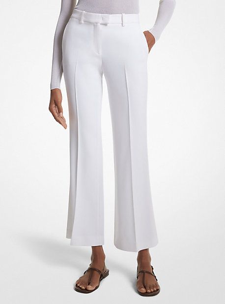 Our coveted Haylee trousers return with a seasonal update for spring. Crafted in Italy from double crepe sablé, this elevated pair is sharply tailored with flared legs and an above-the-ankle hem to create a streamlined silhouette. Finished with side pockets and crisp pleats down the front, they look especially chic paired with sleek sandals and a cashmere sweater or blazer. Elegant Tailored Flare Bottoms, Elegant Wide Leg Pants With Pressed Crease For Spring, Elegant Spring Wide Leg Pants With Pressed Crease, Elegant Fitted Pants With Flared Cuffs, Elegant Flare Dress Pants For Formal Occasions, Chic Flared Dress Pants With Pressed Crease, White Flared Formal Bottoms, Elegant Flare Bottoms With Pressed Crease, Elegant Tailored Flare Pants