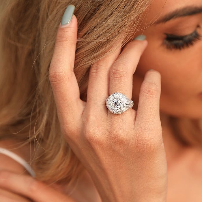 This glam round signet ring is sure to charm, featuring a full paved front and sparkling zirconias for an elegant yet playful twist on the classic evil eye. Round, stylish and full of personality, this ring will be the talk of the town! • S P E C I F I C A T I O N • Crafted in recycled sterling silver, paved AAA cubic zirconias Halo Ring With Pave Setting In Cubic Zirconia, Elegant Cubic Zirconia Signet Ring With Pave Setting, Cubic Zirconia Halo Ring With Pave Setting, Cubic Zirconia Cluster Ring With Pave Setting, Cubic Zirconia Brilliant Cut Signet Promise Ring, Glamorous Round Crystal Ring In Cubic Zirconia, Glamorous Round Cubic Zirconia Crystal Ring, Cubic Zirconia Open Signet Promise Ring, Glamorous Round Rings With Diamond Accents