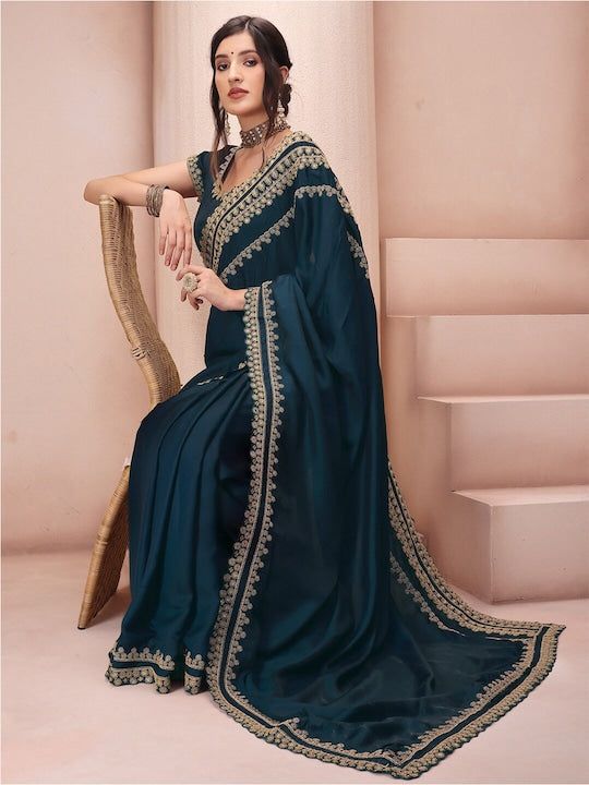 Teal and gold-toned sareeEthnic motifs embroidered saree with embroidered border borderHas embroidered detailThe saree comes with an unstitched blouse pieceThe blouse worn by the model might be for modelling purpose only. Check the image of the blouse piece to understand how the actual blouse piece looks like. Saree Sale, Ethnic Dress, Organza Saree, Blue Paisley, Teal And Gold, Thread Work, Georgette Sarees, Embroidered Silk, Blouse Piece