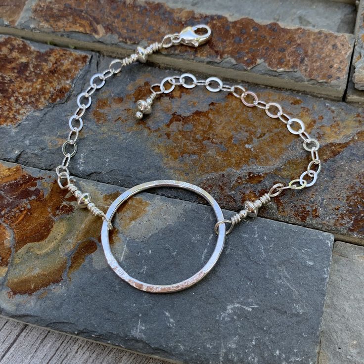 A simple circle bracelet in sterling silver hammered in my signature texture. Circle is about 1” in diameter. Silver bracelet is adjustable up to 8". Modern Hammered Bracelets For Everyday, Hand Forged Sterling Silver Minimalist Bracelets, Simple Hammered Sterling Silver Jewelry, Minimalist Hand Forged Sterling Silver Bracelets, Adjustable Hammered Everyday Bracelets, Minimalist Sterling Silver Diamond Bracelet, Adjustable Hammered Sterling Silver Jewelry, Everyday Hammered Bracelet Jewelry, Hand Forged Minimalist Bracelets