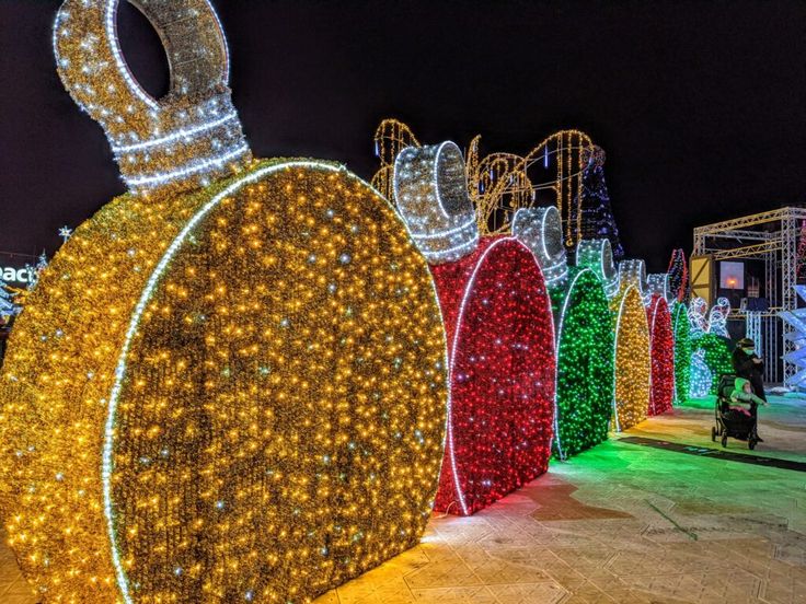 a large display of christmas lights and decorations in the shape of santa's sleigh