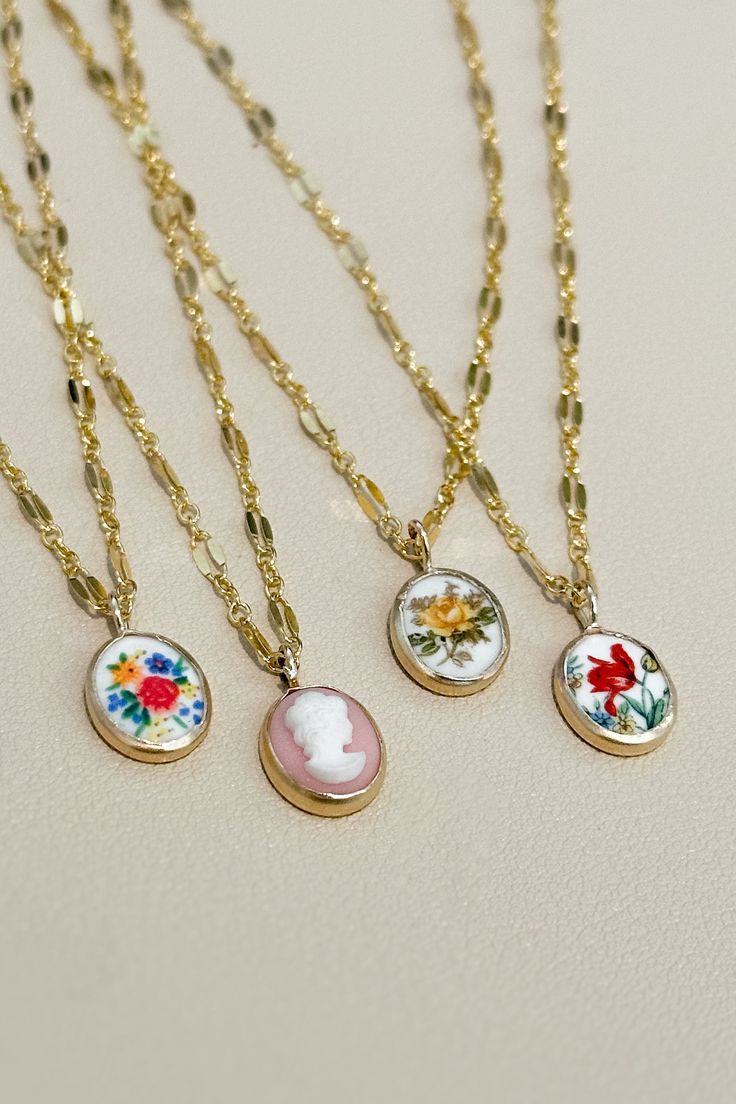 Vintage floral cabochons and cameos <3 Hangs on the most perfect, classic 16" chain. Elegant Charm Necklaces With Pressed Flowers, Elegant Necklace With Round Pendant Of Pressed Flowers, Elegant Round Pendant Necklace With Pressed Flowers, Elegant Vintage Collection Necklaces With Round Pendant, Elegant Vintage Necklace With Round Pendant, Elegant Vintage Round Pendant Necklace, Vintage Delicate Chain Necklace, Vintage Charm Flower Pendant Necklace, Elegant Pressed Flower Jewelry