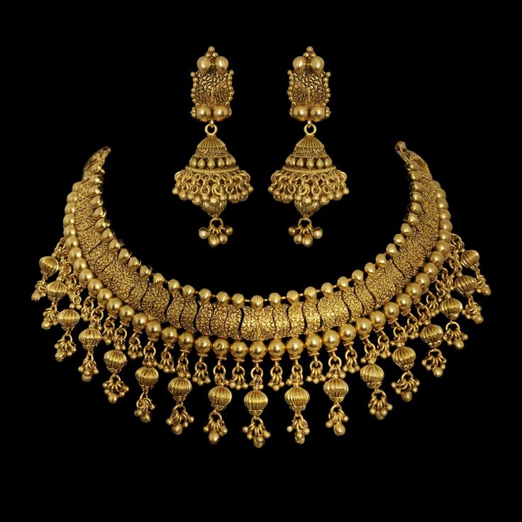 22k Gold Plated Indian Necklace, a dazzling piece of Temple Jewelry. This Choker Necklace exudes timeless elegance and is ideal for weddings and special occasions. Crafted in the South Indian tradition, it reflects the rich heritage of Temple Jewelry. Adorn yourself with the intricate designs of this Temple Necklace Set, perfect for making a statement. Whether it's a wedding or a grand celebration, this piece adds a touch of sophistication to your ensemble. *𝐏𝐑𝐎𝐃𝐔𝐂𝐓 𝐃𝐄𝐓𝐀𝐈𝐋* * Materi Gold Half Set Designs, 22k Gold Necklace Indian Jewelry, Elegant Gold Bridal Necklace For Wedding, Classic Hand-set Gold Jewelry Sets, Classic Gold Jewelry Sets, Classic Gold Jewelry For Wedding, Classic Gold Bridal Necklace With Elegant Design, Temple Jewelry Style Necklace With Tilla For Anniversary, Gold Jewelry With Intricate Design For Marriage