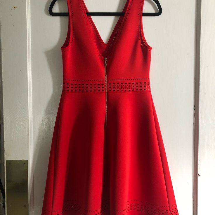 Guess V Neck Fit And Flare Dress. Beautiful And Vibrant Red. 90% Polyester And 10% Spandex. Very Stretchy Material With Beautiful Cut Out Detailing At Waist And Hem. Size 8. Waist And Bust Measurements In Pics, Length From Shoulder To Hem Is 36 Inches. Never Worn. Red Elastane Summer Dresses, Red Midi-length Elastane Dress, Red Midi Length Elastane Dress, Chic Red Elastane Midi Dress, Red Elastane Spring Dress, Red Stretch V-neck Midi Dress, Red Lined Midi Dress With V-neck, Red Lined V-neck Midi Dress, Red V-neck Lined Midi Dress