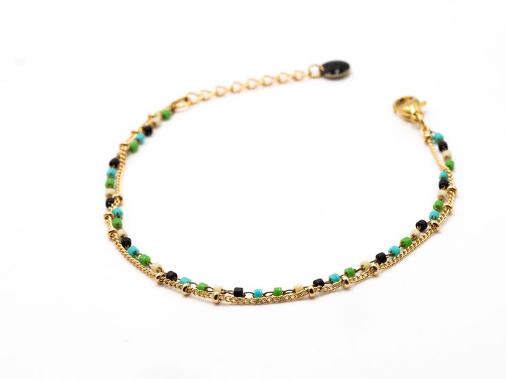 Delicate, minimalist bracelet, composed of 2 rows of fine chains: - a chain gilded with fine gold (1 micron) decorated with small beads - and a chain decorated with tiny Miyuki glass beads in delicate colors (brown, green, beige, turquoise, gold...). The beads measure 1mm, which gives the bracelet a very light appearance. The bracelet has a 3 cm extension chain, finished with a small black enameled sequin. This bracelet is adaptable to wrists between 15-18 cm. (other dimensions possible on reque The Vivienne, Small Beads, Gift For Woman, Colors Brown, Minimalist Bracelet, Green Beige, Bracelet Collection, Ankle Bracelets, Black Enamel