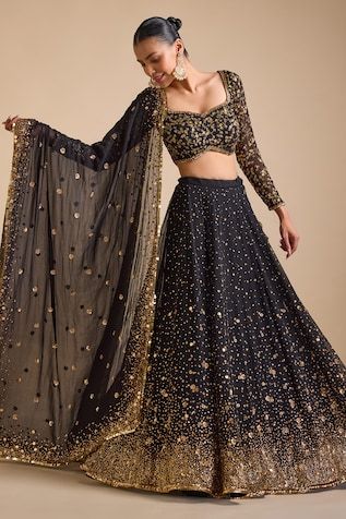 Black can can attached lehenga featuring sequin bead floral scatter motifs highlighted by sequin gradient hemline. Comes with padded floral sequin embroidered blouse and sequin embellished tasselled dupatta. - Aza Fashions Black Sabyasachi Lehenga, Floral Lehenga Choli, New Wedding Lehenga Designs, Cocktail Function Outfit, Lehnga Top Designs Latest, Prevasu Lehenga, Indian Wedding Sangeet Outfit, Women Lehenga Indian Weddings, Black Lehenga For Wedding